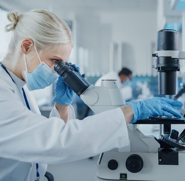 Female scientist at microscope