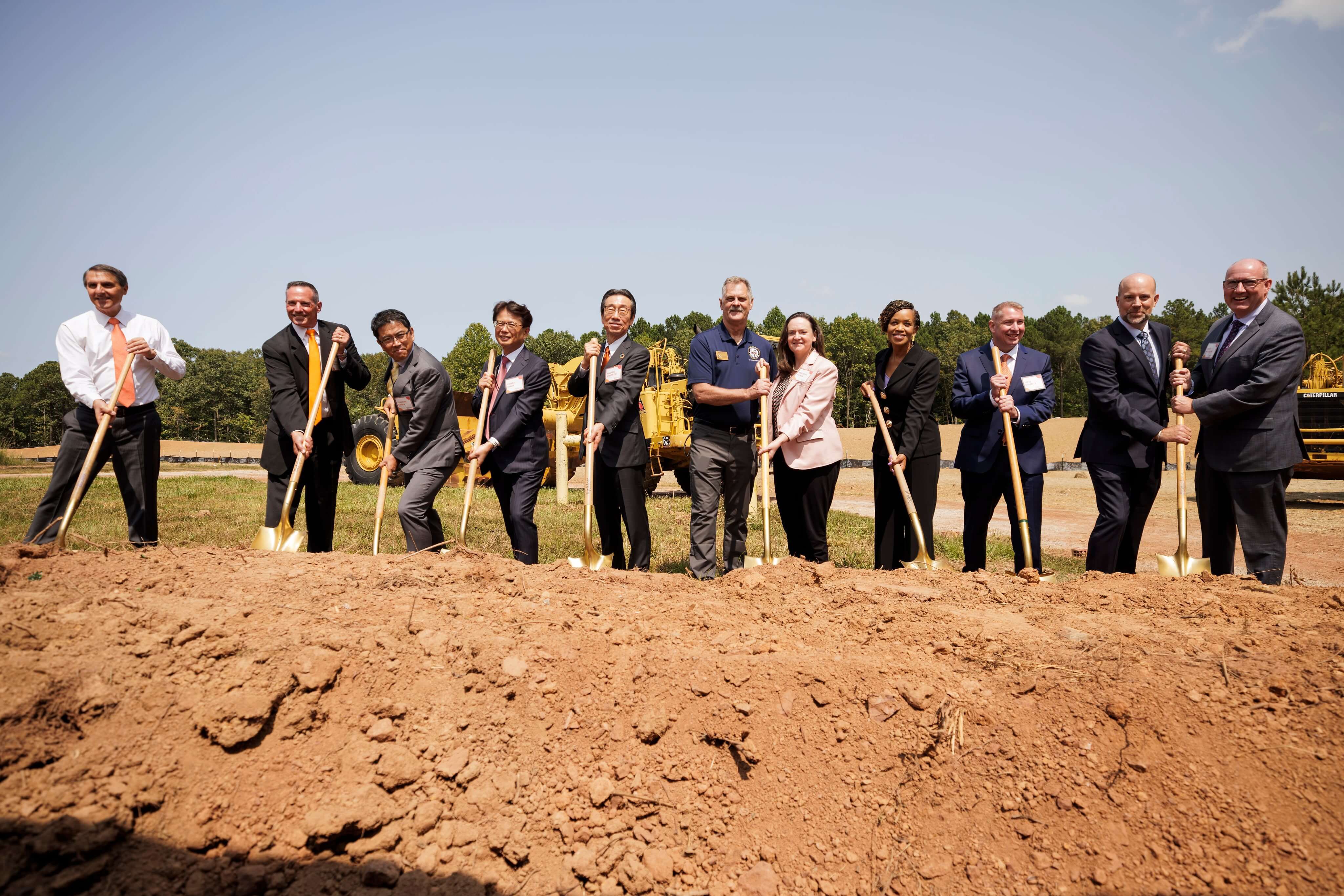 people breaking ground at building site