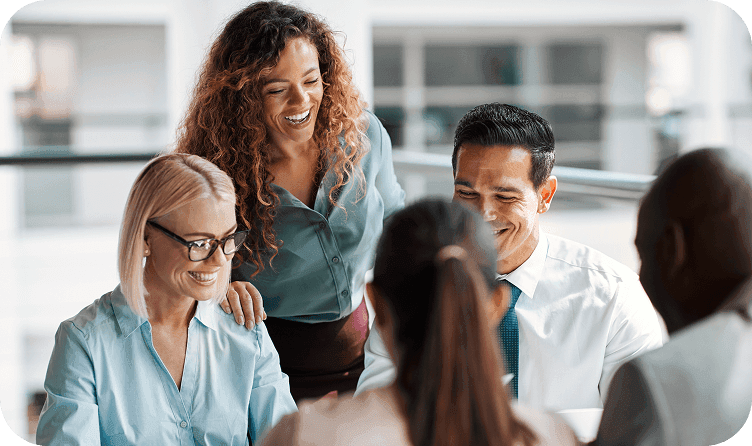 Workers around table at office