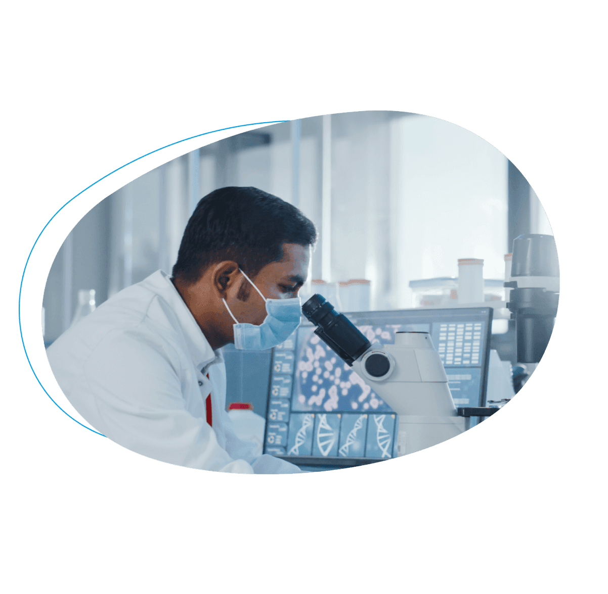 male scientist at microscope