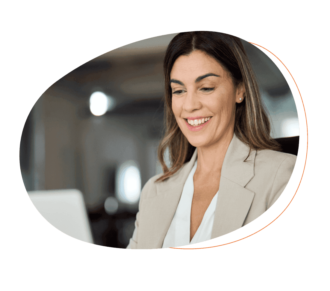 Smiling woman looking at laptop